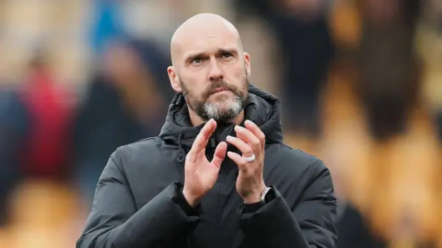 Luke Williams applauds Swansea's fans after the draw at Norwich