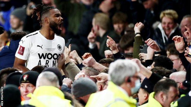 Bournemouth's players celebrate with fans after beating Bournemouth in the FA Cup