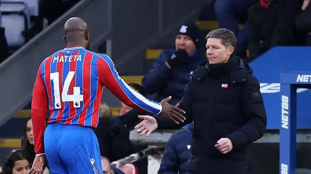 Mateta and Glasner about to shake hands