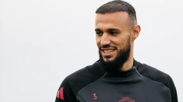 Noussair Mazraoui smiles during a Manchester United training session