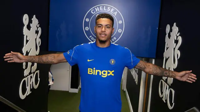 Morgan Rogers in the tunnel at Stamford Bridge. He wears a Chelsea shirt.