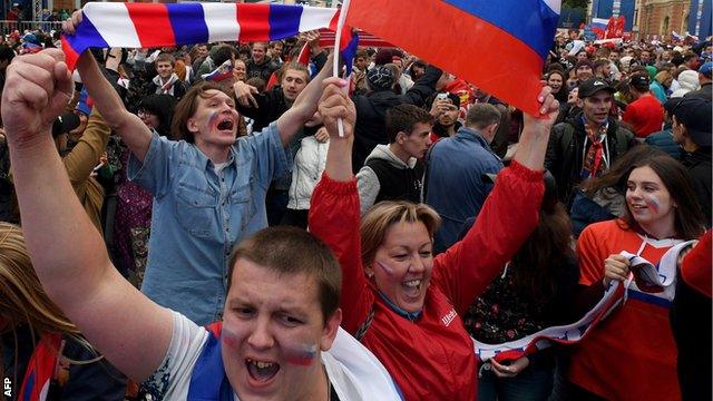 Russian football fans celebrate their teams win over Spain