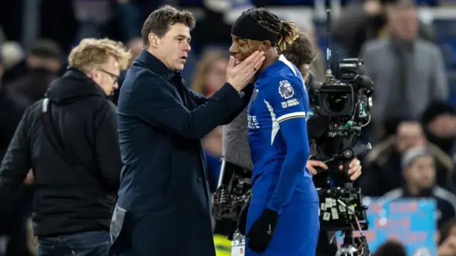 Mauricio Pochettino (left) embraces Noni Madueke