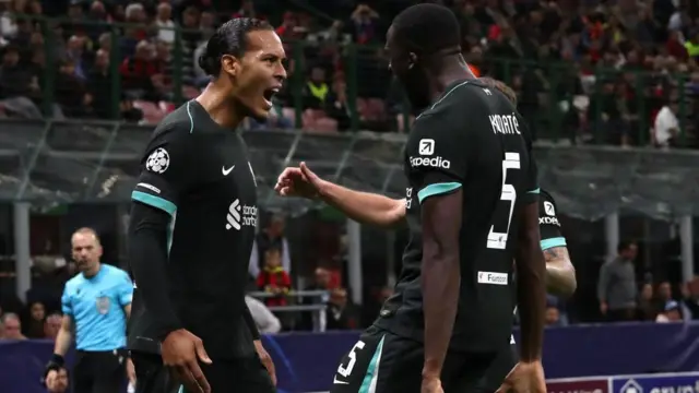 Virgil Van Dijk and Ibrahima Konate celebrate against AC Milan