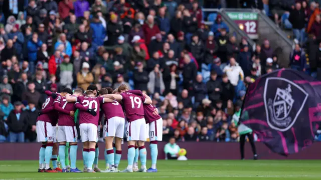 Burnley players in a huddle