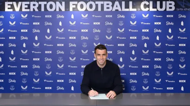 Seamus Coleman poses for a photo after signing a new contract with Everton at Goodison Park