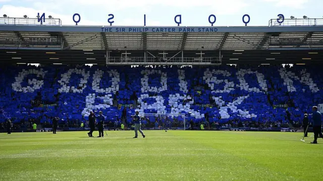 A Goodison Park mosaic is held aloft by Everton fans