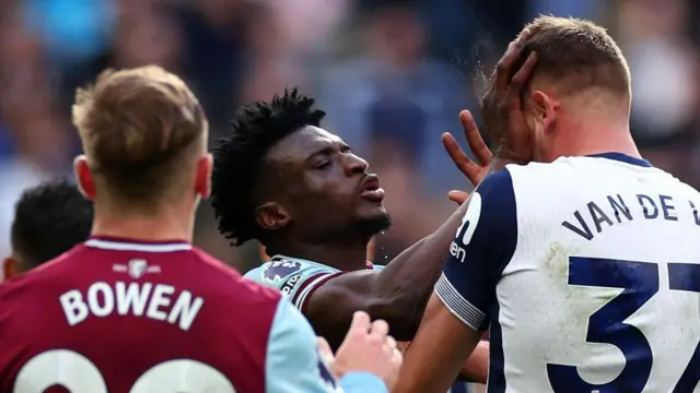 Mohammed Kudus of West Ham United clashes with Micky van de Ven of Tottenham Hotspur and is subsequently shown a Red card during the Premier League match between Tottenham Hotspur FC and West Ham United FC at Tottenham Hotspur Stadium