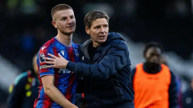 Adam Wharton is hugged by Oliver Glasner after a Crystal Palace fixture