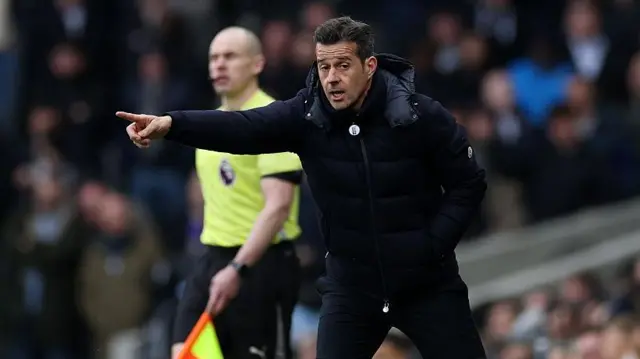 Marco Silva on the touchline at Craven Cottage. He points to offer instruction.