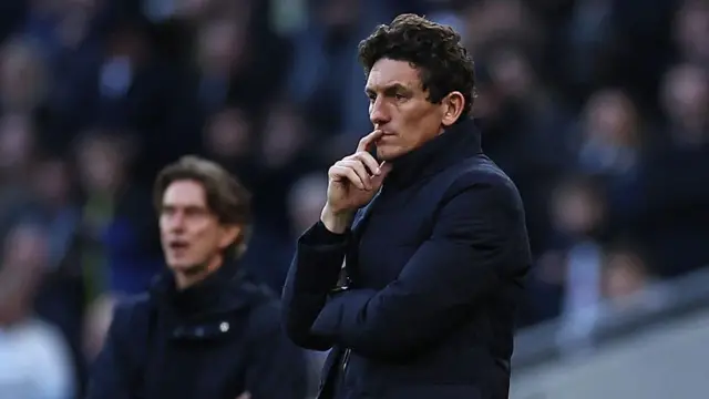 Brentford head coach Keith Andrews looks on from the sideline against Spurs