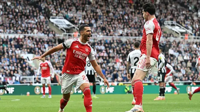 Mikel Merino of Arsenal celebrates scoring his team's first goal with teammate Declan Rice