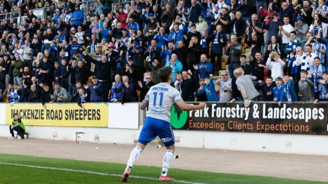 Danny Armstrong celebrates in front of the Killie fans