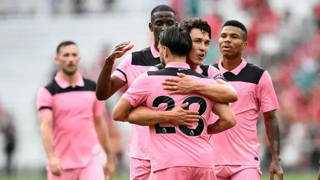 Sunderland players celebrate their first goal during the first half 
