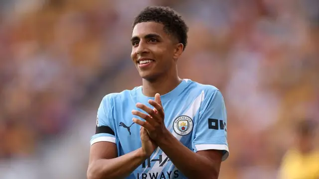Rico Lewis playing for Manchester City