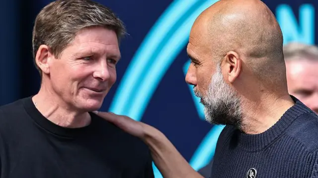 Crystal Palace manager Oliver Glasner talks to Manchester City manager Pep Guardiola 