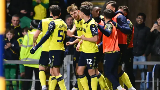Oxford United players celebrating scoring against Ipswich Town