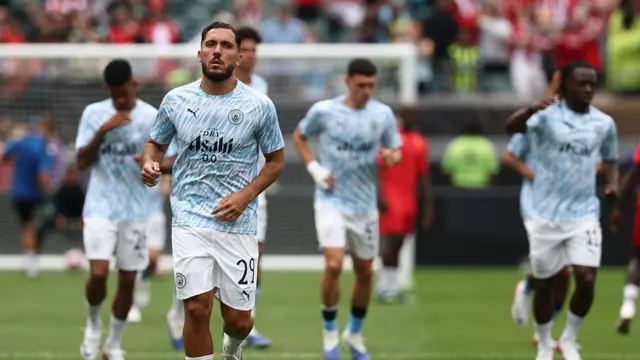 Rayan Cherki warms up for Manchester City
