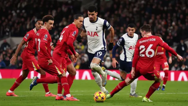 Virgil van Dijk, Andy Robertson and Curtis Jones surround Dominic Solanke