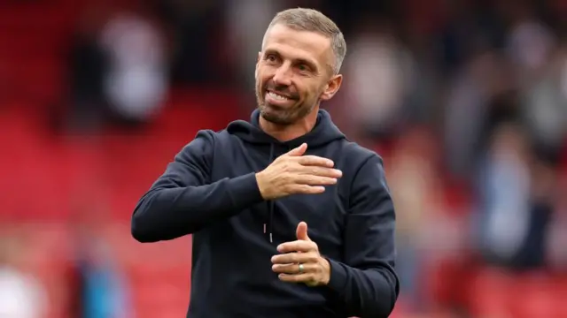 Gary O'Neil, Manager of Wolverhampton Wanderers, acknowledges the fans