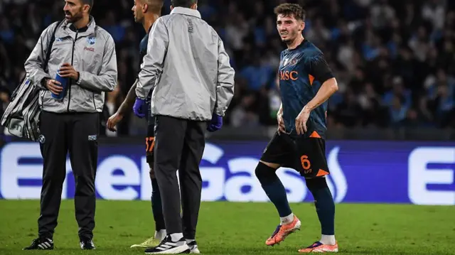 Napoli's Billy Gilmour (right) grimaces against Como