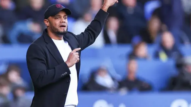 Vincent Kompany gestures from the touchline