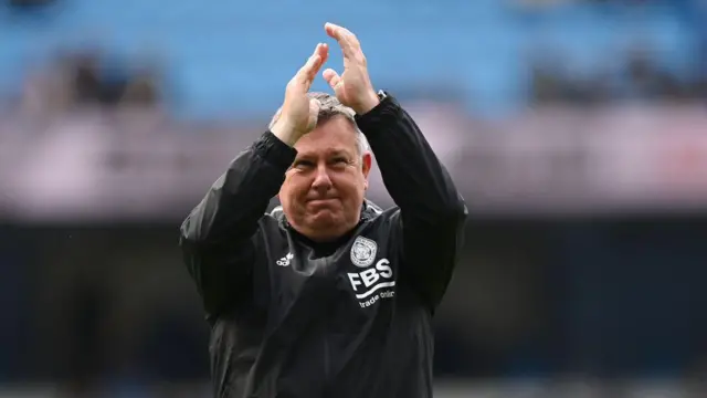 Craig Shakespeare of Leicester City applauds the fans