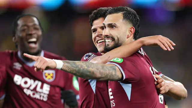 Taty Castellanos celebrates