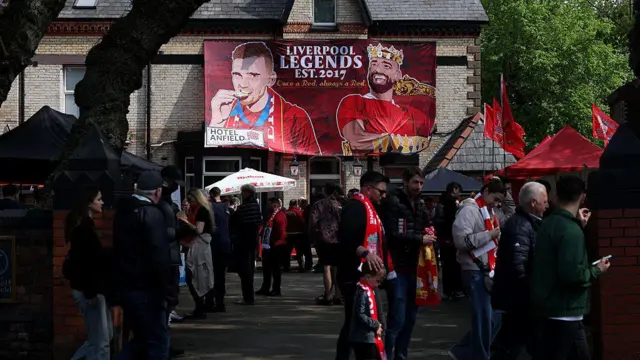 A banner celebrating Andrew Robertson and Mohamed Salah is seen outside a pub on Anfield Road
