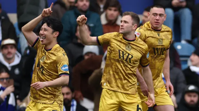Blackburn Rovers celebrate a goal by Ryoya Morishita (L)