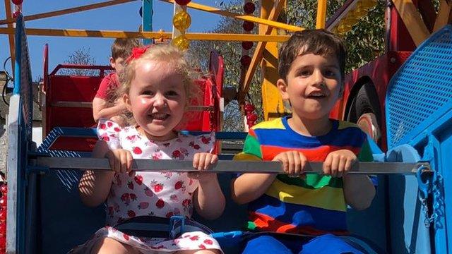 Scarlett and Zak enjoying a fairground ride in North Yorkshire