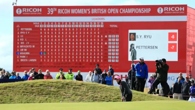 Pettersen looks on with the scoreboard behind her
