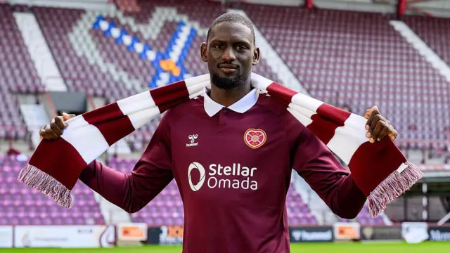Amadou Ba-Sy signs for Heart of Midlothian at Tynecastle Park on June 9, 2026 in Edinburgh, Scotland.