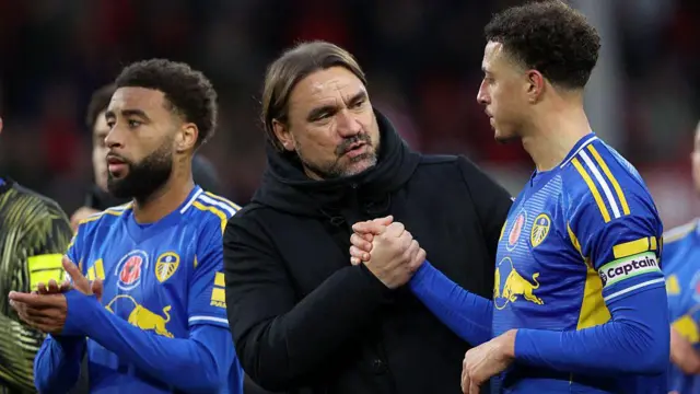 Daniel Farke Manager of Leeds United and Ethan Ampadu of Leeds United shake hands after a Premier League match