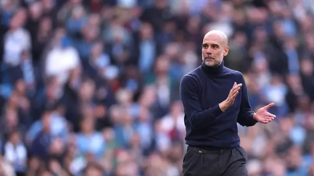 Pep Guardiola applauds the City fans