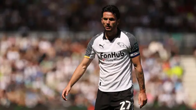 A photo of Lewis Travis playing football in his Derby County home kit