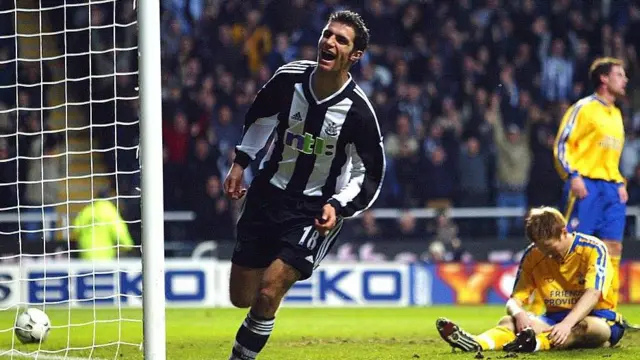 Aaron Hughes celebrates scoring for Newcastle