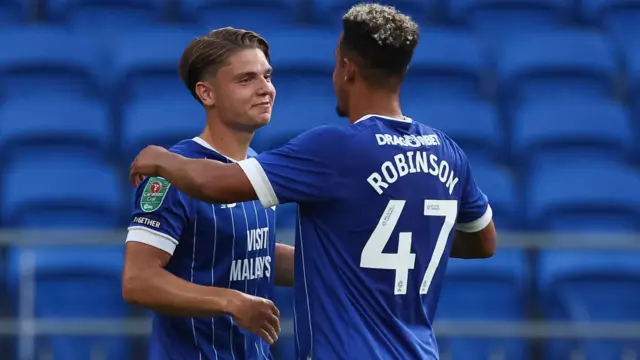 Cian Ashford celebrates scoring against Swindon last season with Callum Robinson 