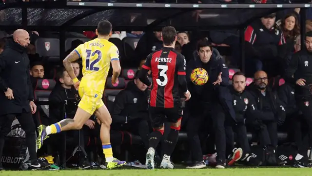 Andoni Iraola, Manager of AFC Bournemouth, throws the ball to Milos Kerkez