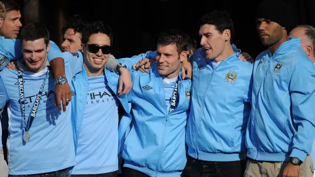 James Milner celebrates with his team-mates after winning the 2011-2012 Premier League