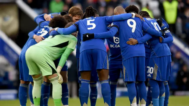 Leicester City players huddle before kick-off