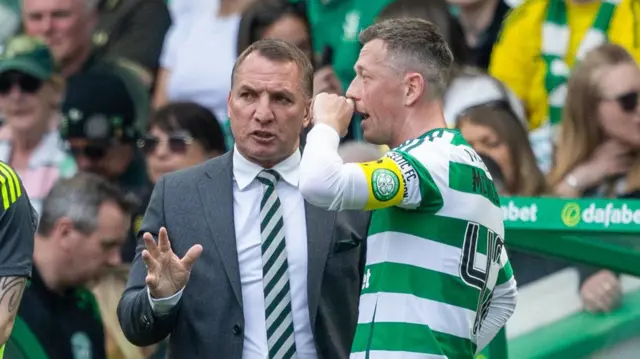 Brendan Rodgers talks to Callum McGregor