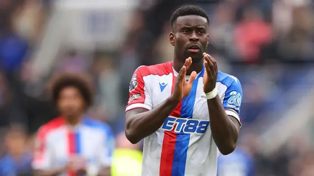 Marc Guehi applauds the Crystal Palace fans
