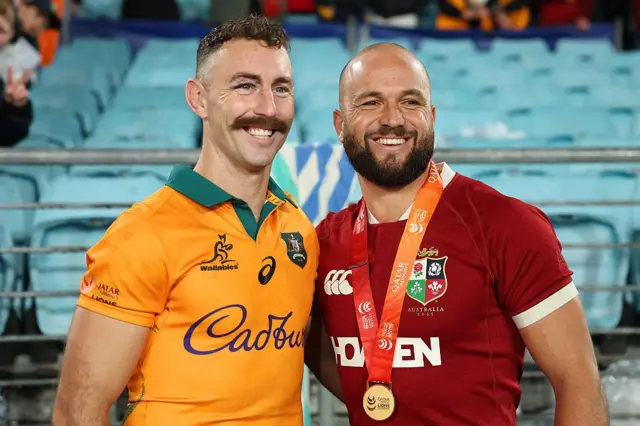 Nic White of the Wallabies and Jamison Gibson‑Park of the British and Irish Lions pose for a photo