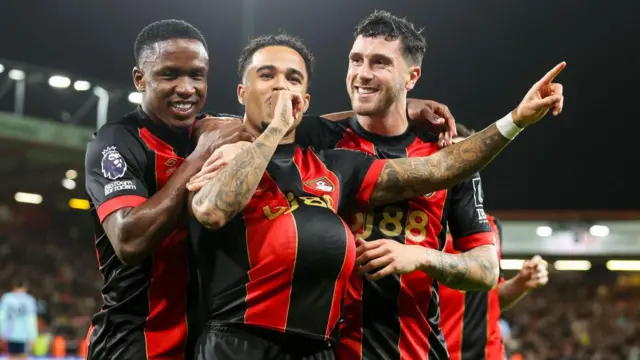 Luis Sinnistera, Justin Kluivert and Marcos Senesi celebrate a Bournemouth goal