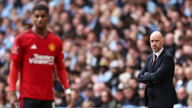 Manchester United manager Erik ten Hag stares at Marcus Rashford