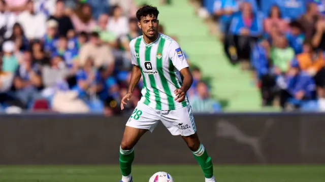 Chadi Riad looks on with the ball at his feet