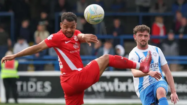 Larne's Olatunde Bayode in action against Coleraine's Dean Jarvis during Saturday's Irish Premiership game at Ballycastle Road