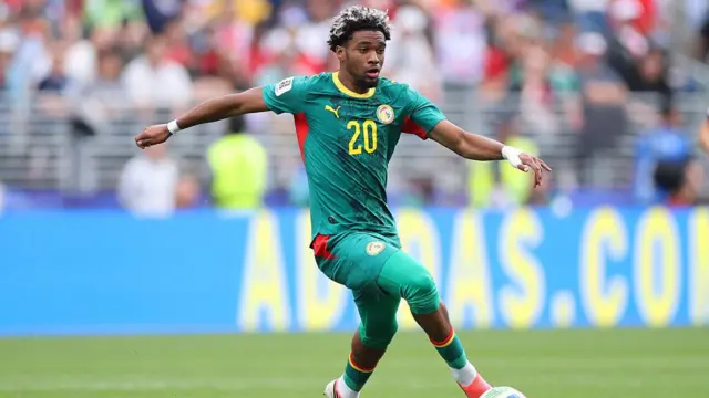 Ibrahim Mbaye of Senegal controls the ball