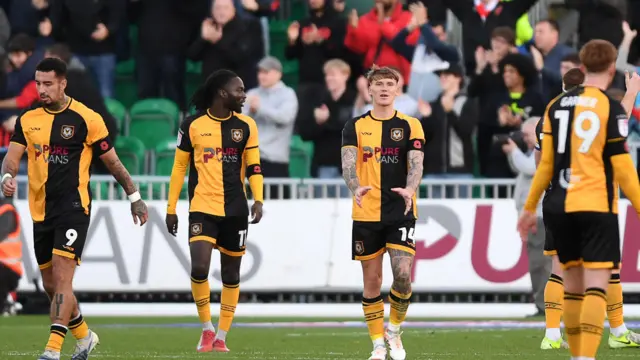Newport players look dejected after conceding a goal against Walsall